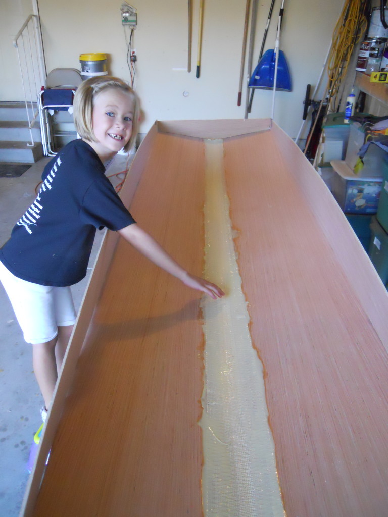 Here's Abigail helping me tape the panels together with Extra Strength Fibatape and Titebond II. If I were using epoxy she would not be able to help.