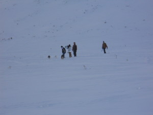 Boys trudging towards the sledding hill.