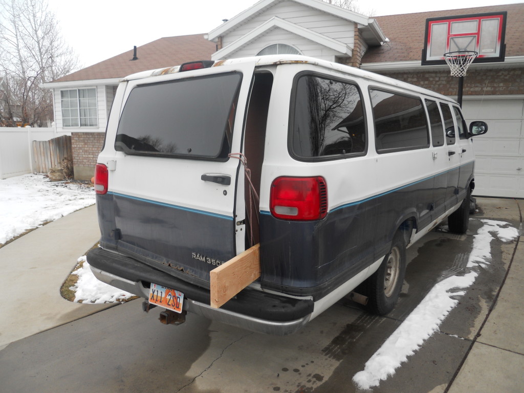 A 16 foot board nearly fits in the Monster Van without any sort of finagling. I think that if I had aimed for the foot well it would have fit entirely. Tying up the door was good enough for me.